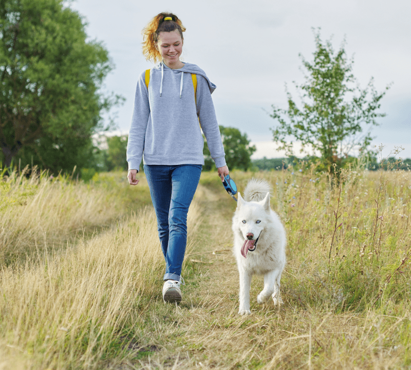 LADY WALKING DOG